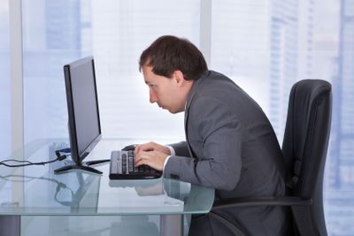 Concentrated Businessman Working On Computer In Office