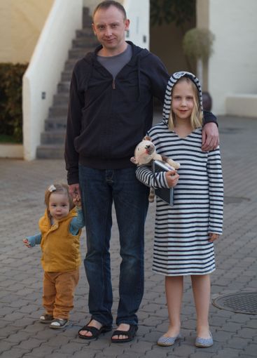 Happy father and two daughters together, portrait