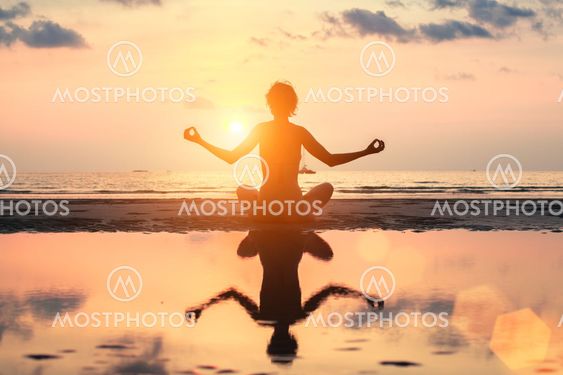 Silhouette meditation yoga woman on the background of the...
