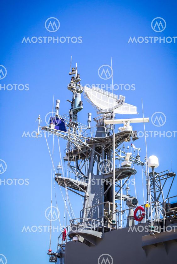Radar on battleship with blue sky