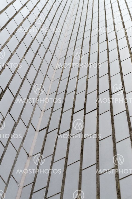 Abstract upward view of white rectangle brick wall