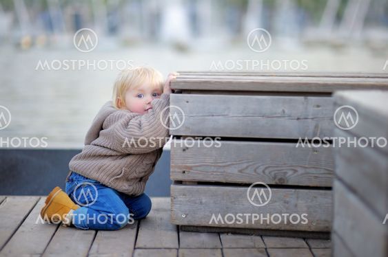 Toddler boy playing outdoors