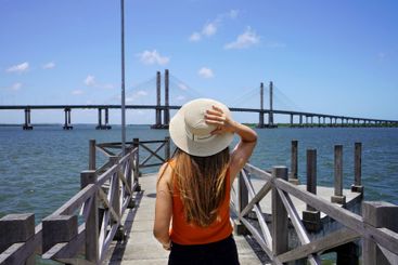 Tourism in Aracaju, Brazil. Back view of young woman on...