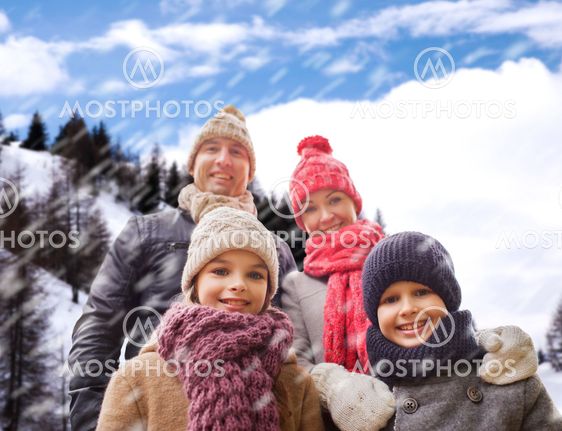 happy family in winter clothes outdoors
