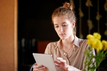 Tablet, search and woman in cafe with remote work,...