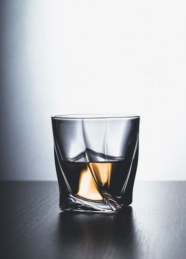 Strong alcoholic drink in glass close up