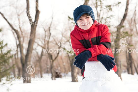 portrait of a boy in a winter park
