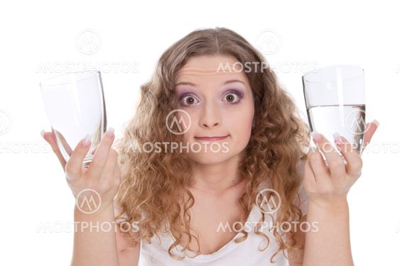 Half empty or half full? - woman isolated on white...