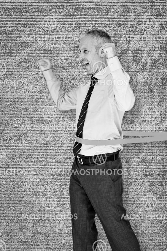 Composite image of businessman winning race