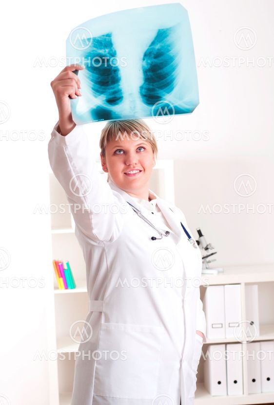 Female medic looking at x-rays