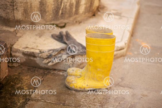 Yellow work boots and gloves