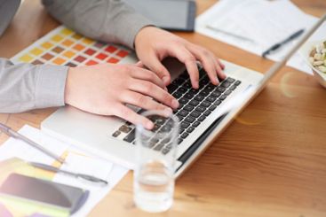 Hands, laptop and typing with color palette at startup,...