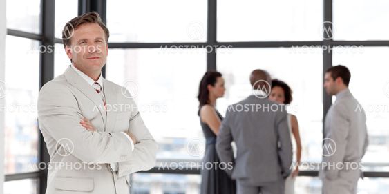 Attractive confident male manager leading his team