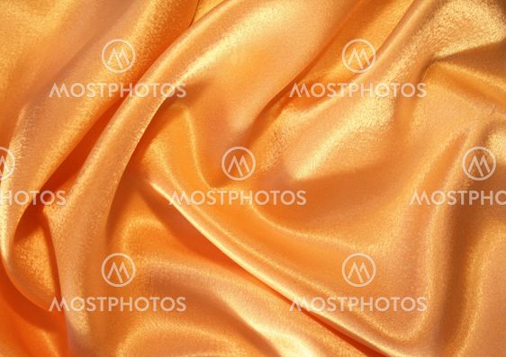 Smooth elegant golden silk as background