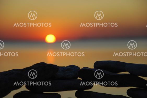 Sunset at a stone wall