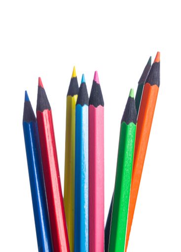 Vibrant collection of colored pencils arranged in a...