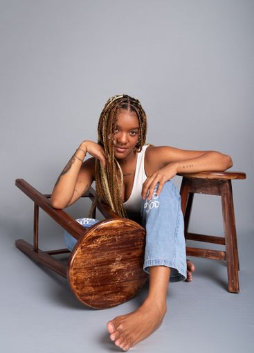 Beautiful brunette woman with braids in her hair,...