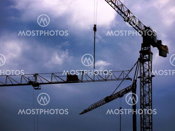 Cranes and rain clouds