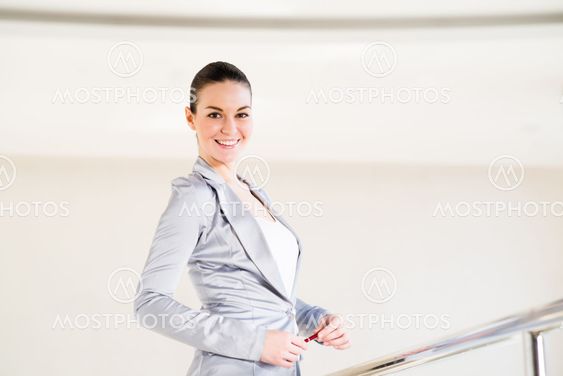 Business woman standing in the lobby of the office