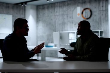 Police questioning witness in dark room during...