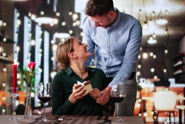 Romantic Couple Sitting Having Dinner