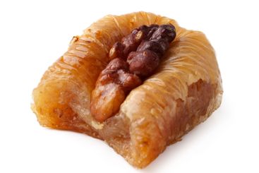 Traditional dessert featuring nut filling served on a...