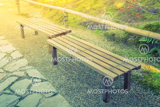 Wooden bench in the park ( Filtered image processed...