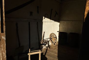 Vintage tools and wooden items illuminated by sunlight...