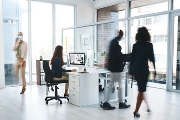 Motion blur, computer and business woman in office for...