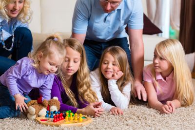 Family playing board game at home
