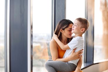 Young happy family loving mother and her child son...