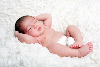 Cute baby asleep on cloud