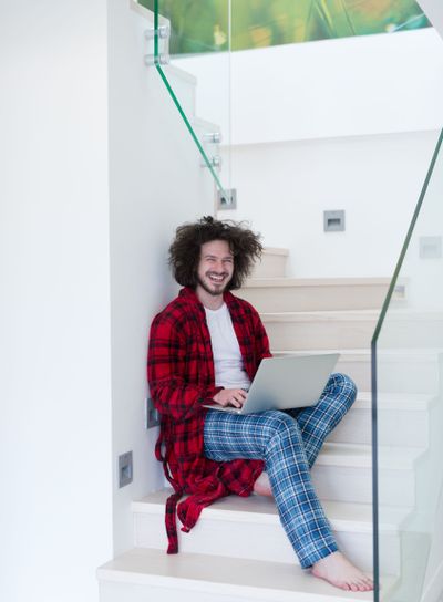 freelancer in bathrobe working from home