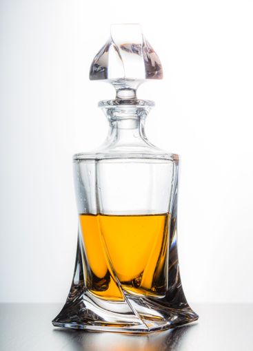 Strong alcoholic drink in glass close up