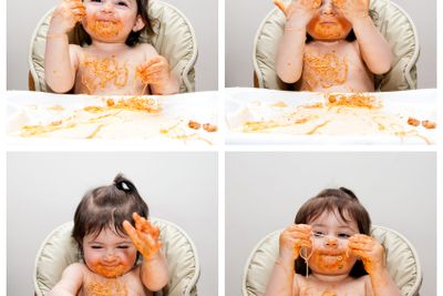 Happy baby funny messy eater