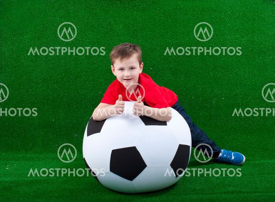 Happy young boy with soccer ball
