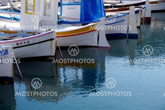 fishing boats reflected in the water