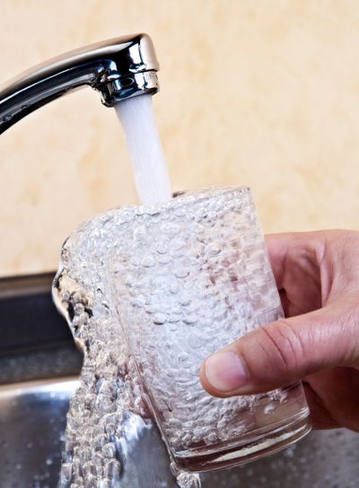 Water flows into a glass