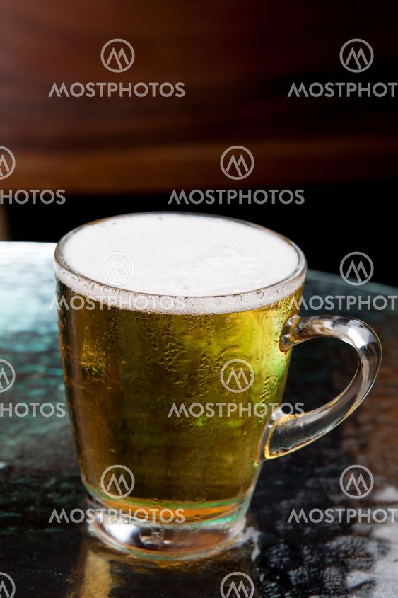 full lager beer in glass mug
