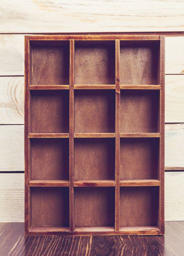 Cozy pastel wooden home decor objects on blue background