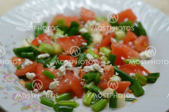 Salad with tomatoes, cheese and onions