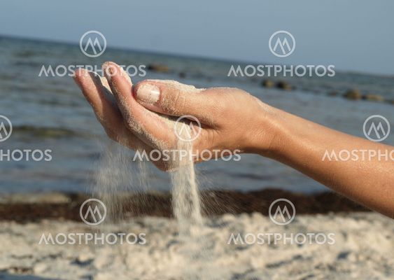 hand on the background of the sea