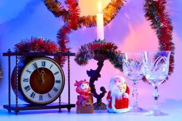 Happy New year.Santa Claus. vintage clock, wine glasses,...