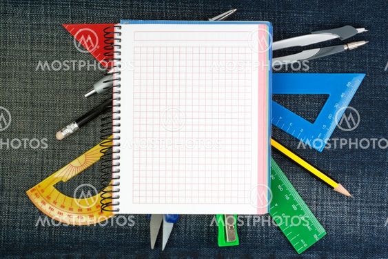 Notebook for school supplies on the background jeans.