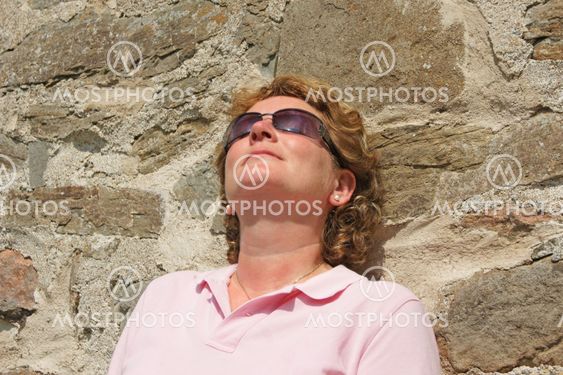 Women against brick wall