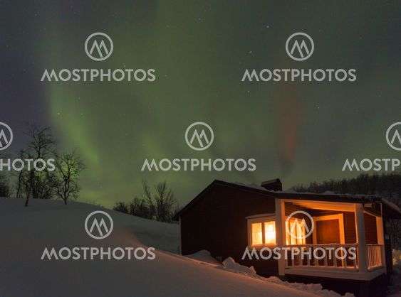 Northernlight, Aurora borealis, over a cottage