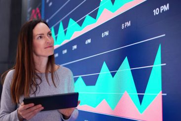 The young female businesswoman conducts advanced AI data...