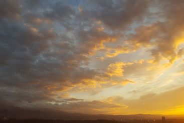 As dusk descends, the horizon is aglow with rich amber...