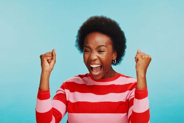 Screaming, winner and black woman with celebration in...