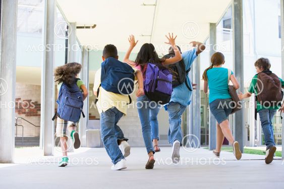 Elementary school pupils running outside